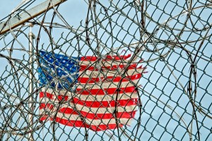 torn flag and barbed wire