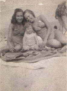 two women and a baby at the beach